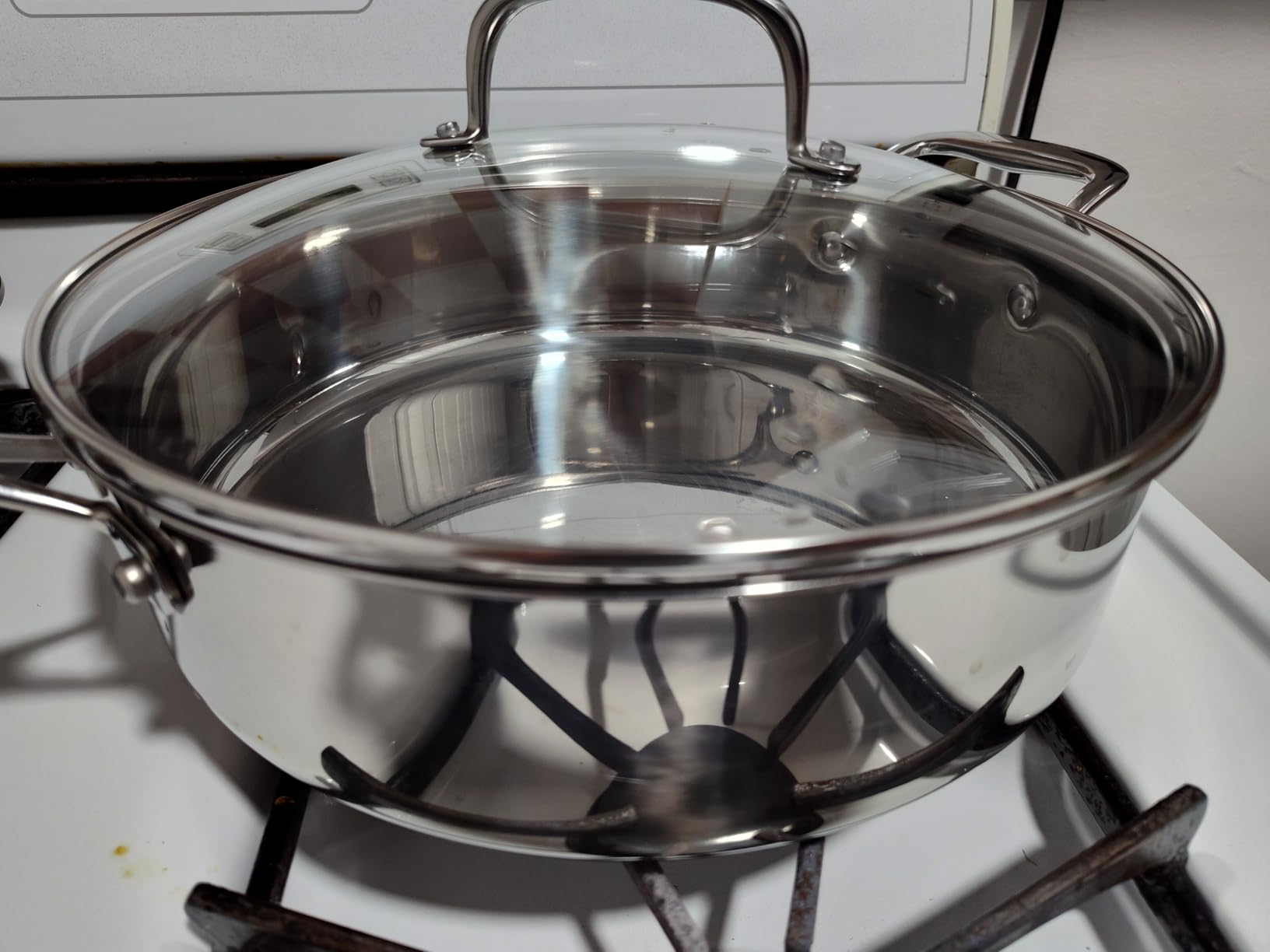 Amazon Basics Stainless Steel Cookware 11-Piece Set, Oven Safe, Pots and Pans, Induction-Ready, Even Heating, Easy to Clean, Heavy Duty, Silver - Customer Photo 4