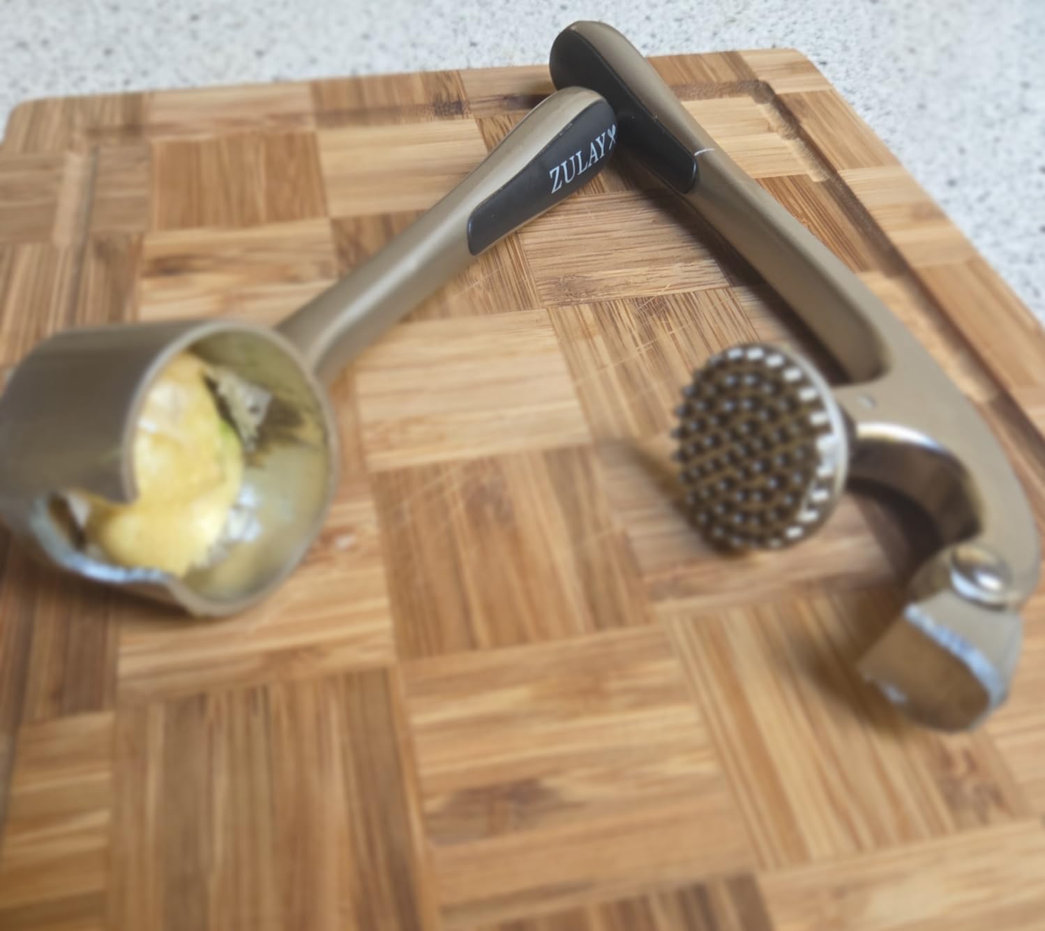 Zulay Kitchen Premium Garlic Press Set - Rust Proof Professional Garlic Mincer Tool - Easy-Squeeze, Easy-Clean with Soft, Ergonomic Handle - Silicone Garlic Peeler & Brush (Silver) customer photo 1