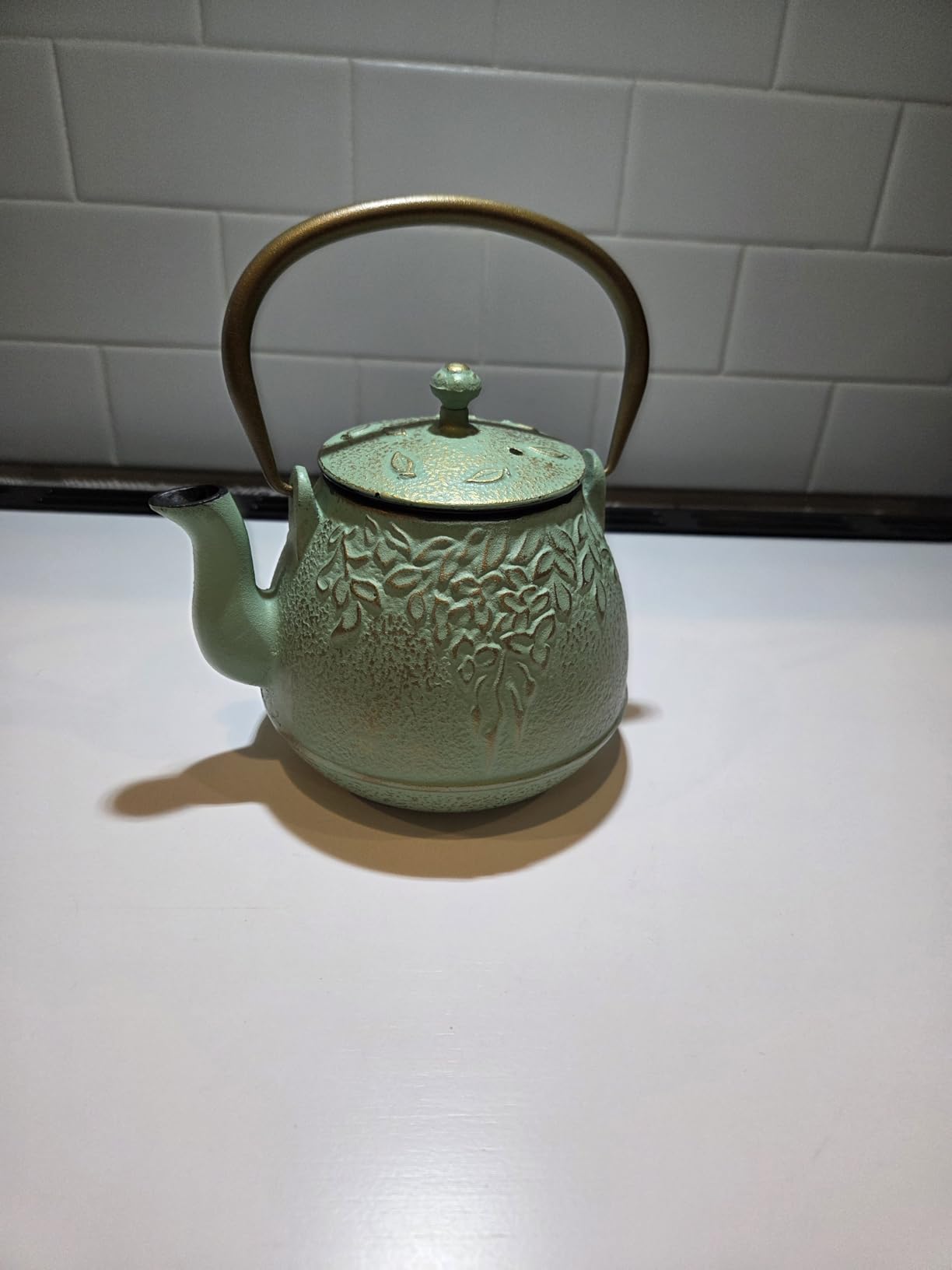 Tea Kettle, TOPTIER Japanese Cast Iron Tea Pot for Stove Top, Cast Iron Teapot Humidifier for Wood Stove, Leaf Design Tea Kettle Coated with Enameled Interior for 32 Ounce (950 ml), Black customer photo 1