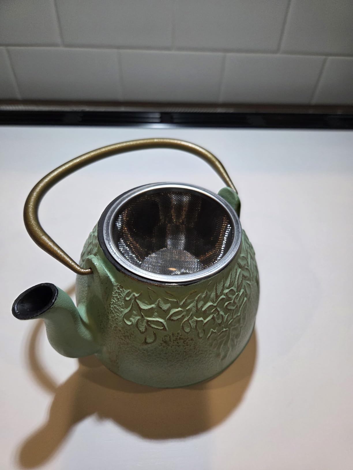 Tea Kettle, TOPTIER Japanese Cast Iron Tea Pot for Stove Top, Cast Iron Teapot Humidifier for Wood Stove, Leaf Design Tea Kettle Coated with Enameled Interior for 32 Ounce (950 ml), Black customer photo 2