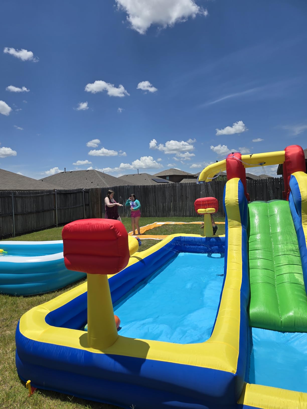 WELLFUNTIME Inflatable Water Park with Blower, Bouncy Castle with Water Cannon and Double Basketball Rings customer photo 1