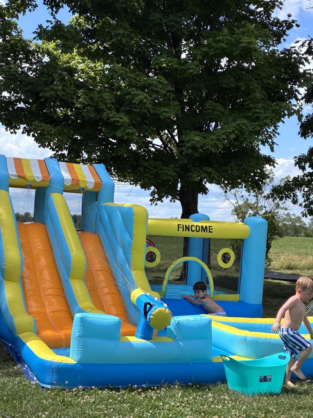 FINCOME Inflatable Bounce House, 10 in 1 Double Water Slide Bounce House with 750W Blower, Climbing Wall, Jumping, Water Gun, Splash Pool, Basketball Hoop for Kids Indoor Outdoor Backyard customer photo 2