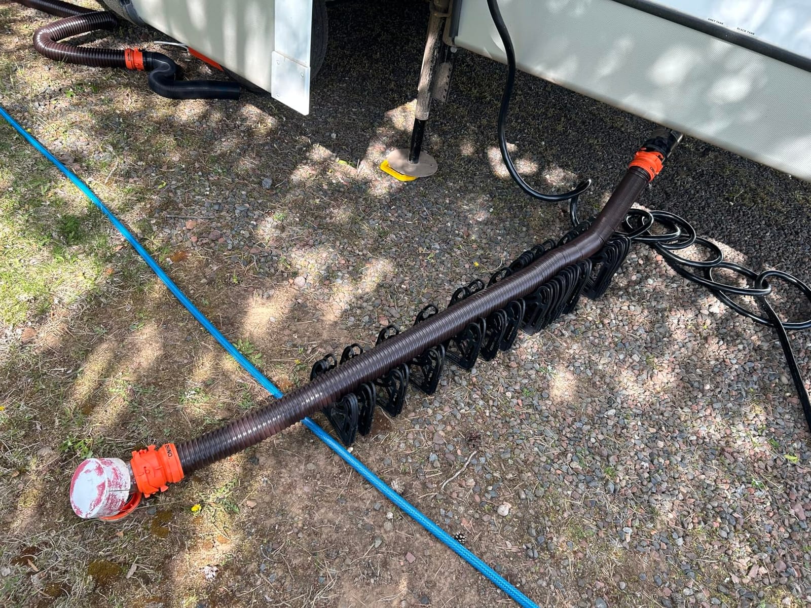 Camco RhinoFLEX 20-Ft Complete RV Sewer Hose Kit - Made in the USA | Includes Clear Elbow w/ Sewer Adapter, (2) 10ft Sewer Hoses, 360 Swivel Fittings - Fits in Standard 4