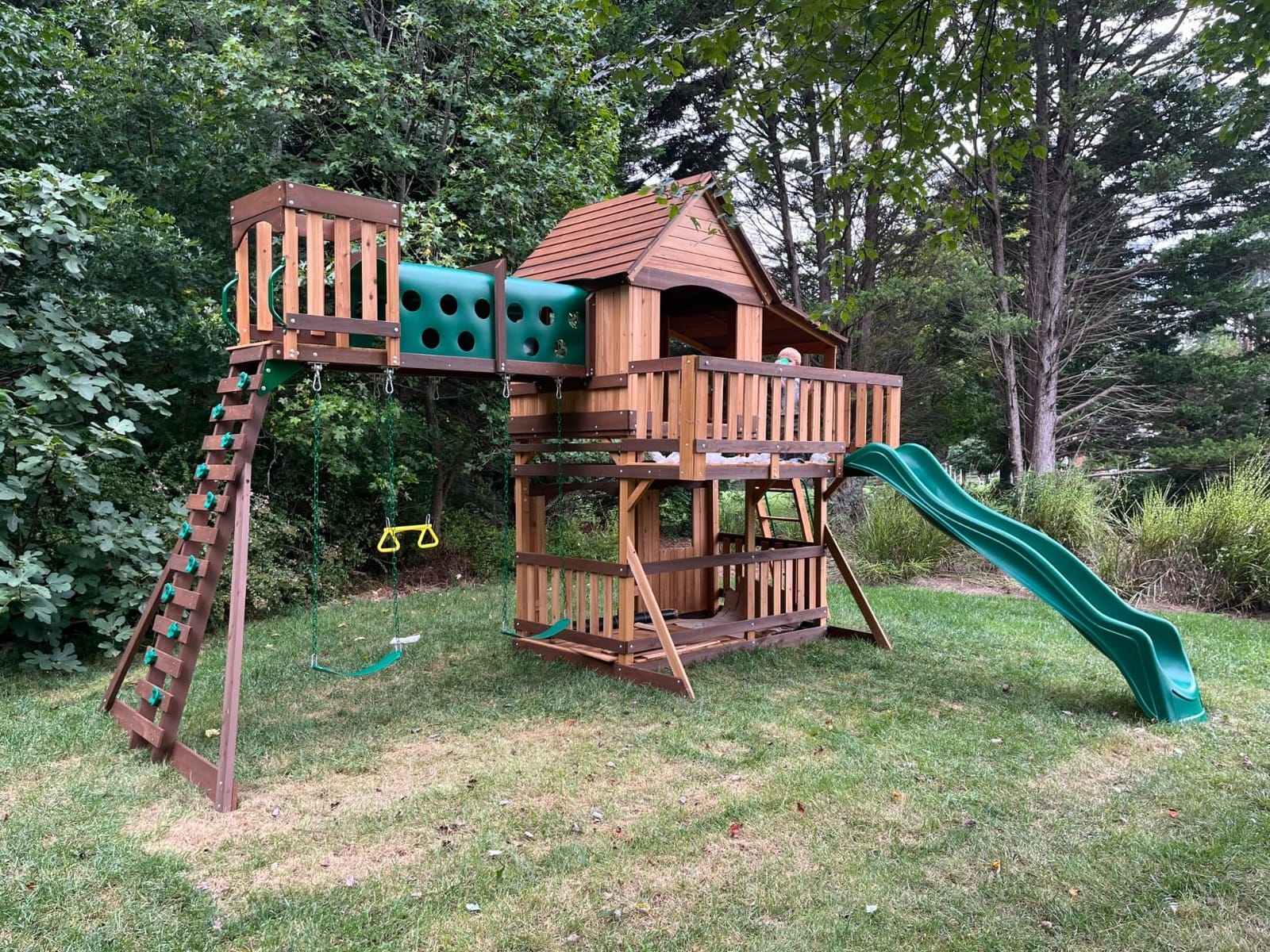 Backyard Discovery Woodridge Elite Cedar Wood Swing Set with Wave Slide, Clubhouse, Crawl Tunnel, Crow's Nest, Belt Swings, Trapeze, Rock Wall Ladder, Sandbox, Wrap-Around Porch, Deck, Outdoor Playset customer photo 1