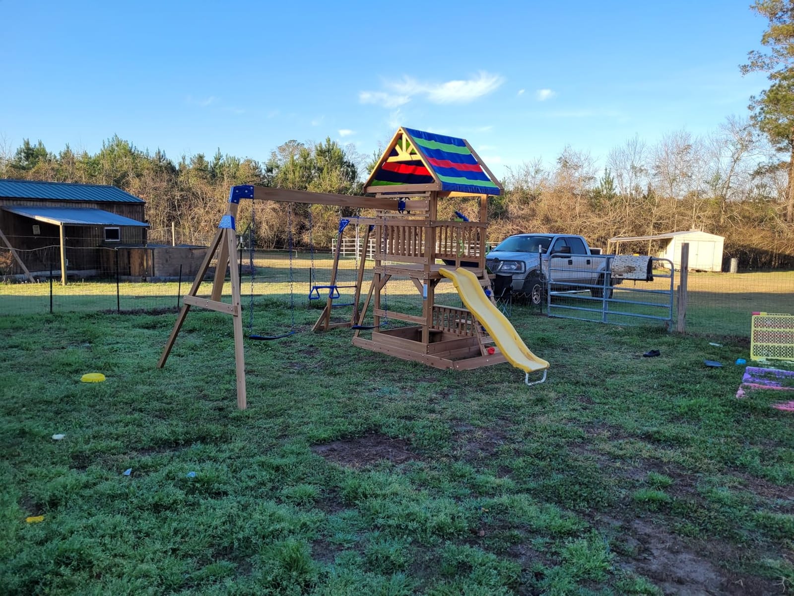 Backyard Discovery Beach Front Cedar Wood Swing Set with Wave Slide, Play Deck, Monkey Bars, Rock Wall Ladder, Shaded Picnic Area, Snack Bar, Belt Swings, Trapeze, Sandbox Area, Outdoor Playset customer photo 1