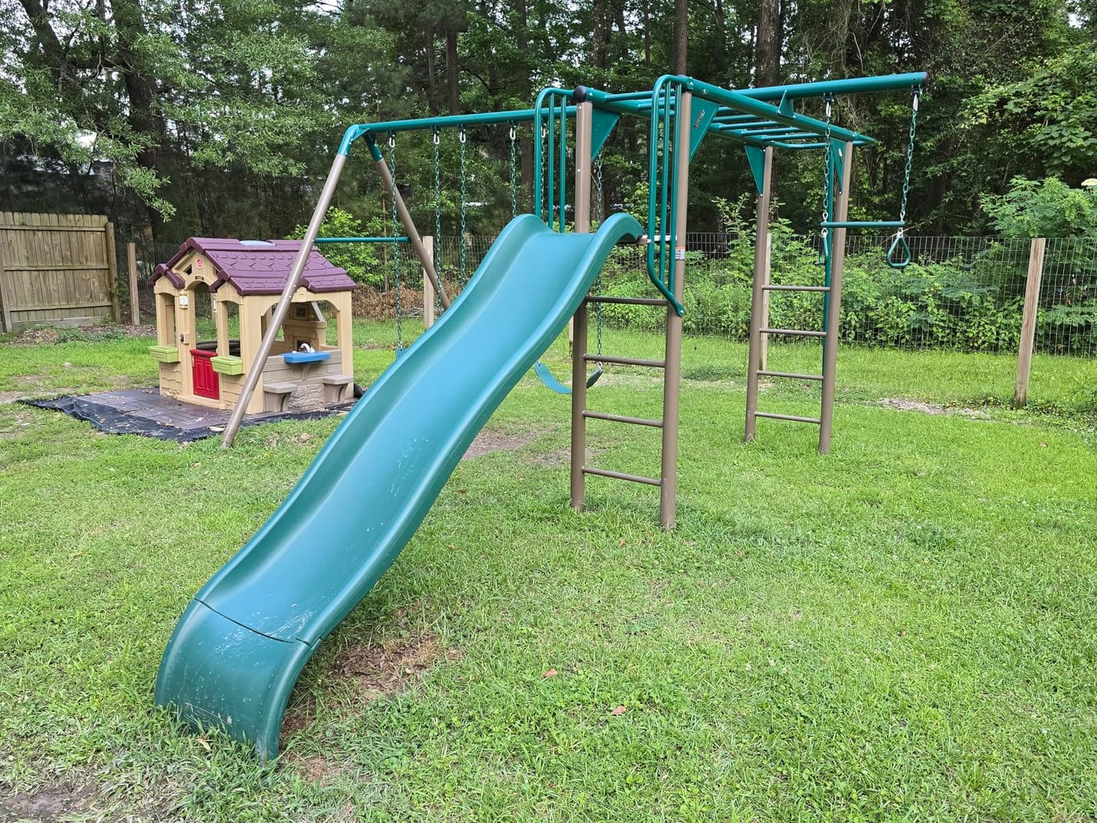 Lifetime 91028 Monkey Bar Adventure Swing Set with 3 Swings, Trapeze Bar, 9-Foot Slide and Fireman's Pole, Earthtone customer photo 1