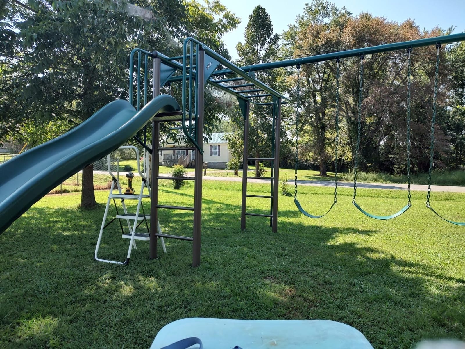 Lifetime 91028 Monkey Bar Adventure Swing Set with 3 Swings, Trapeze Bar, 9-Foot Slide and Fireman's Pole, Earthtone customer photo 2