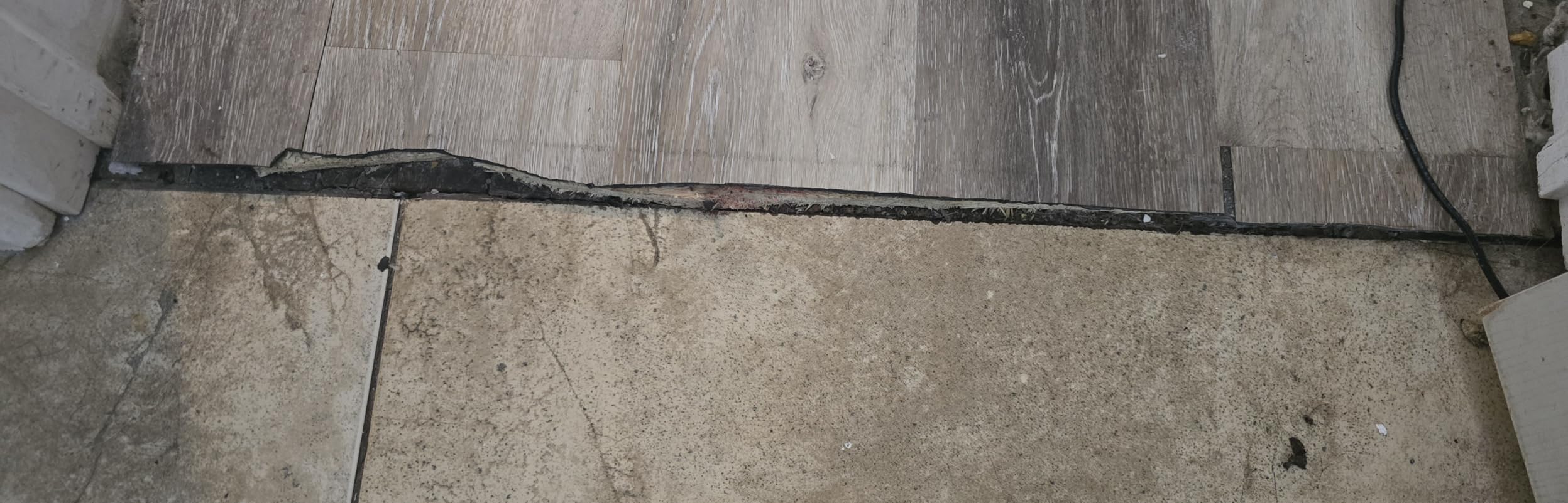 Aluminum Metal Door Threshold, Floor Transition Strip, 36'' L x 2.4'' W x 0.1'' H, Flat-Profile Threshold, Flooring Gaps Carpet Vinyl Wood, Stylish Doorway Transition Draft Protection (Black) customer photo 1